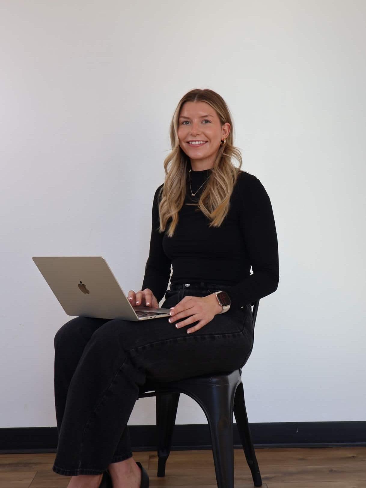 Mary Wunderlich sitting in a leather chair