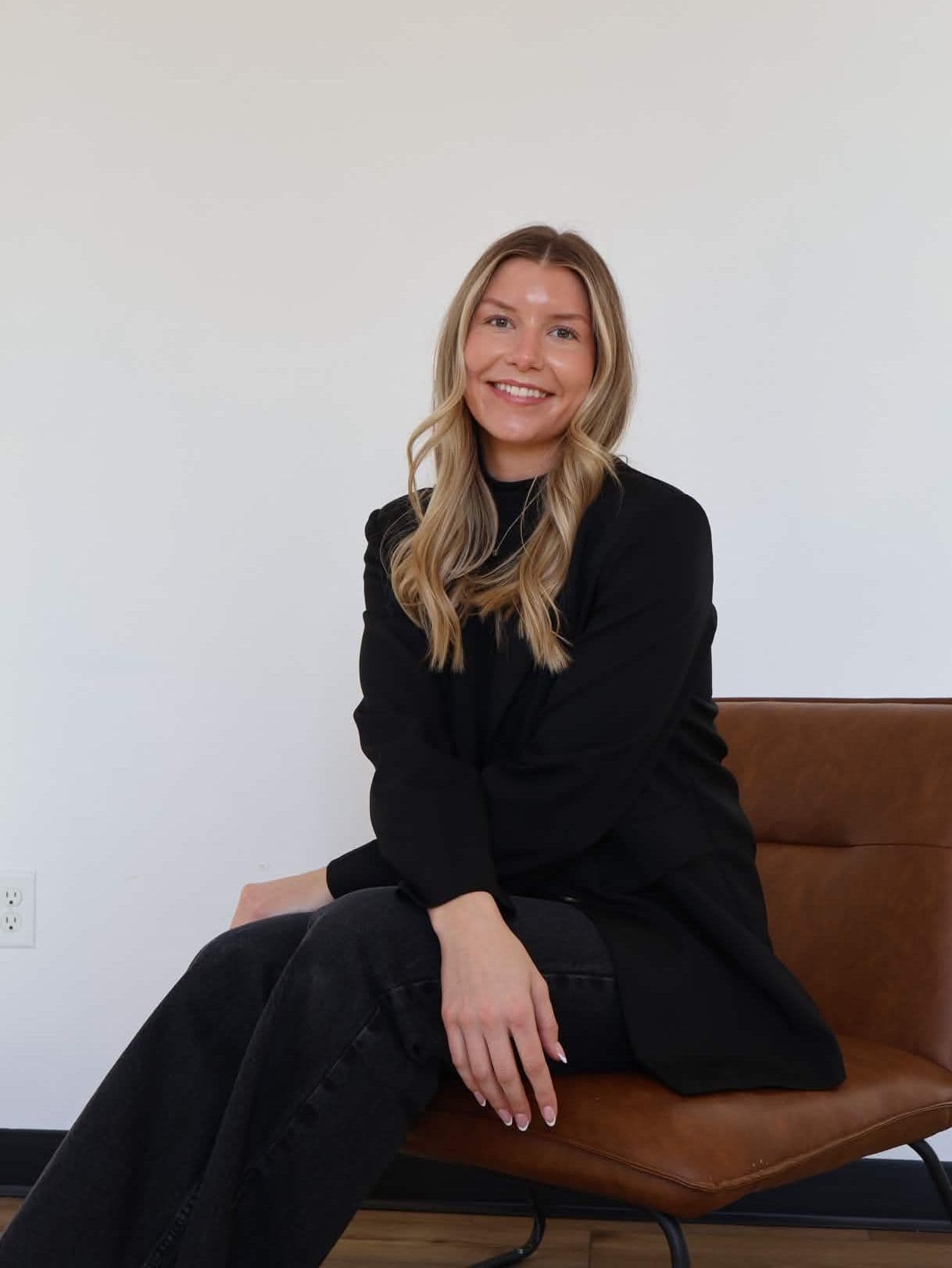 Mary Wunderlich sitting in a leather chair
